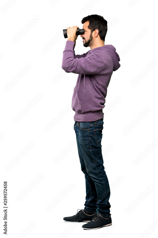 Handsome man with sweatshirt with binoculars Handsome man with sweatshirt with binoculars
