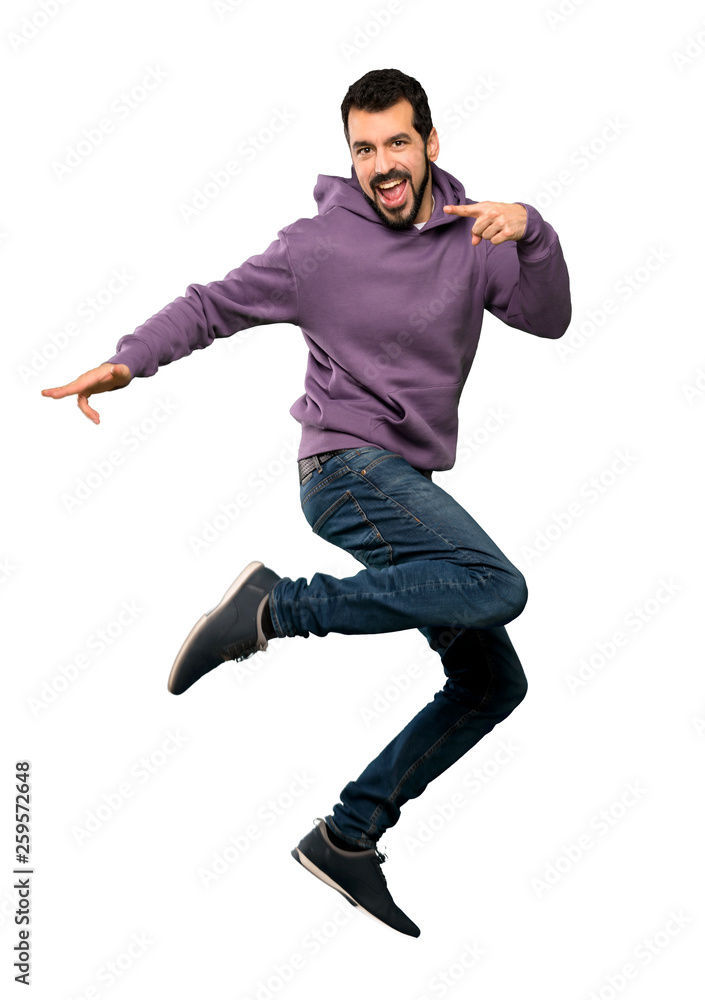 Handsome man with sweatshirt jumping Handsome man with sweatshirt jumping