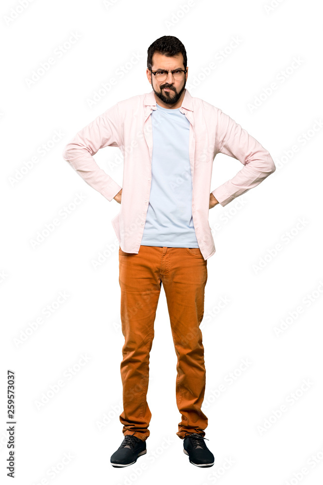 Full-length shot of Handsome man with beard angry over isolated white background Full-length shot of Handsome man with beard angry over isolated white background