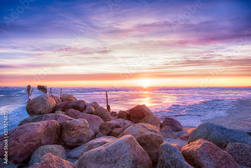 Fototapeta Naklejka Na Ścianę i Meble -  Winter seascape of breakwaters on frozen Baltic sea
