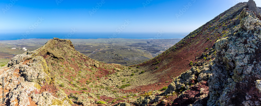 Obraz premium Spain, Lanzarote, Magic colorful volcanic crater of and vale on top of mountain corona volcano