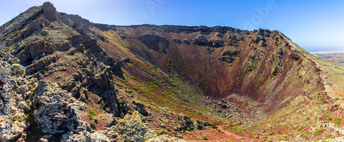 Fototapeta Naklejka Na Ścianę i Meble -  Spain, Lanzarote, XXL panorama from crater rim on top of majestic volcano crater of mountain corona