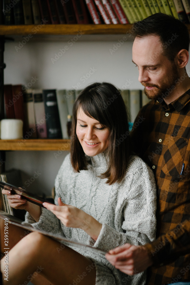 A man and a woman are reading a book. A man and a woman are reading a book.