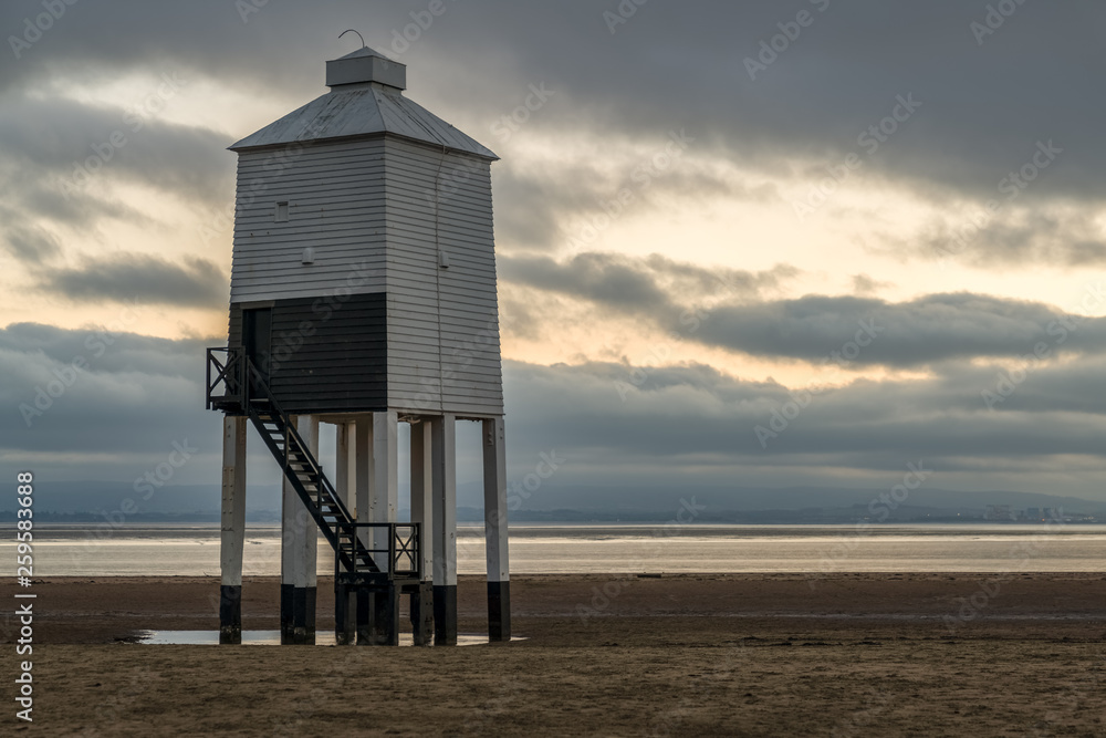 A cloudy evening at the Low Lighthouse in Burnham-on-Sea, Somerset, England, UK