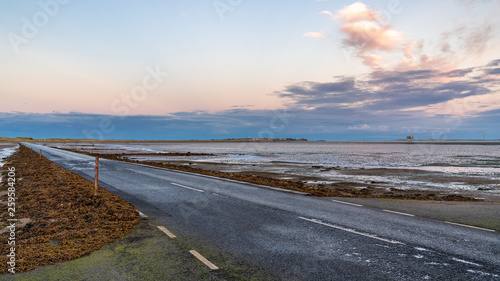 Evening sky and low tide on the road  between Beal and Holy Island  Northumberland  England  UK