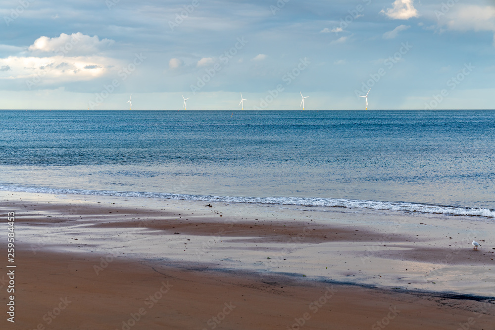 Clouds over wind turbines in the North Sea, seen in Whitley Bay, Tyne And Wear, England, UK