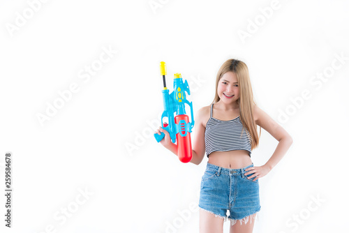 Asian sexy woman with gun water in hand on white background,Festival songkran day at thailand,The best of festival of thai,Land of smile