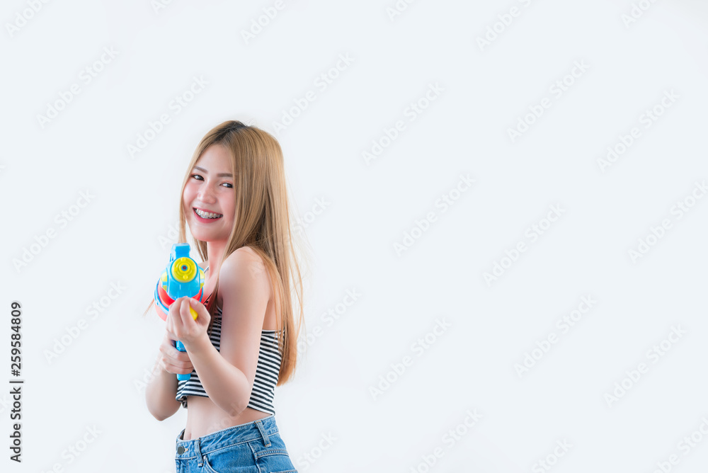 Asian sexy woman with gun water in hand on white background,Festival songkran day at thailand,The best of festival of thai,Land of smile Asian sexy woman with gun water in hand on white background,Festival songkran day at thailand,The best of festival of thai,Land of smile