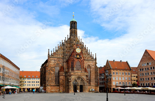 Nuremberg square in Bavarian Germany with the European old-world charm and a gothic medieval church. 