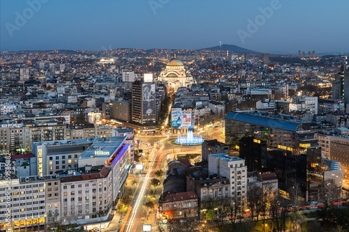 Belgrade, Serbia March 31, 2019: Panorama of Belgrade at night. Belgrade downtown skyline with temple of Saint Sava, new fountain, Hotel Slavija and Slavija square.