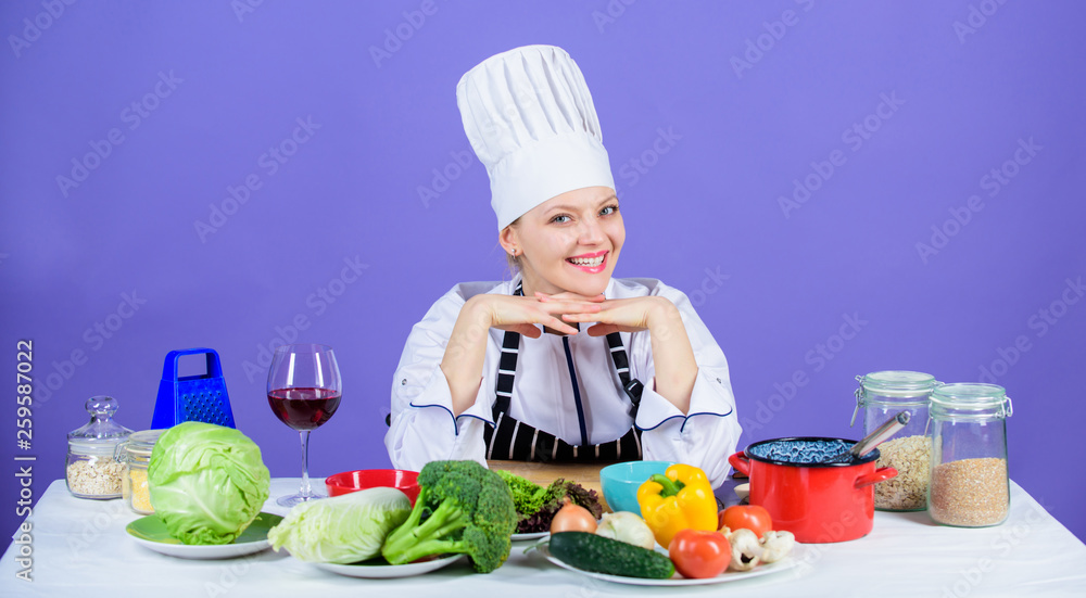 Dish up with vegetable recipe. Happy cook cooking dinner with fresh vegetable recipe. Preparing vegetarian meal with cooking recipe. Pretty chef following vegetable side dish recipe Dish up with vegetable recipe. Happy cook cooking dinner with fresh vegetable recipe. Preparing vegetarian meal with cooking recipe. Pretty chef following vegetable side dish recipe