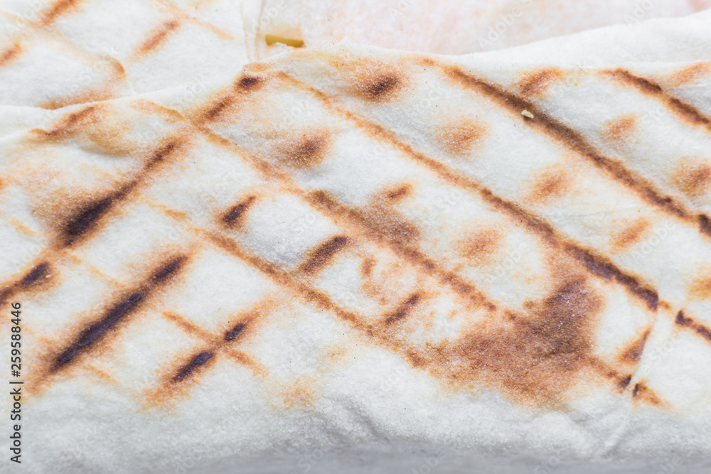 Fried pattern from a grill rhombuses on a shawarma lavash Fried pattern from a grill rhombuses on a shawarma lavash