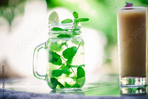 Photography Mojito cocktail served on glass at outdoors, refreshing cuban cocktail