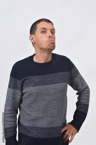 man grimacing on white background