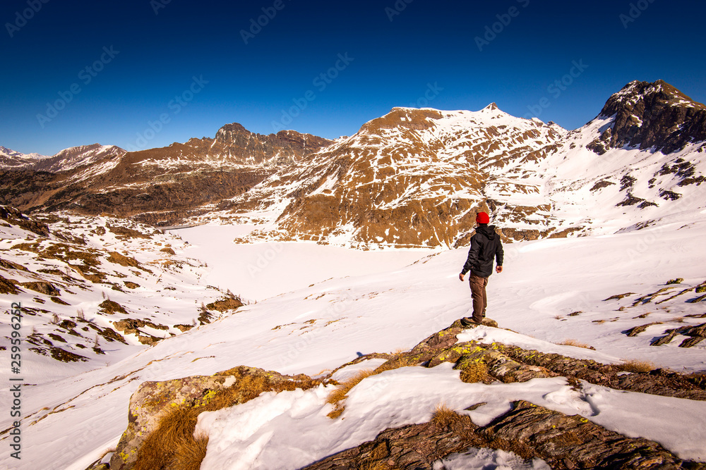 man hiker contemplate the landscape in mountain - time to disconnect concept