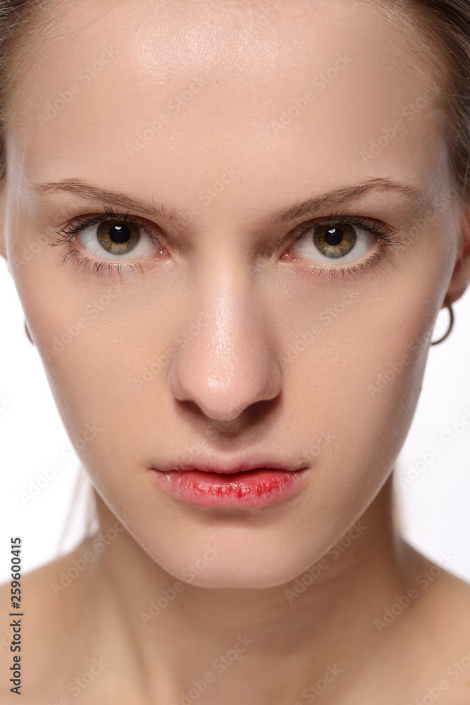 portrait of a young beautiful girl with blood on her lips, on a white background. portrait of a young beautiful girl with blood on her lips, on a white background.