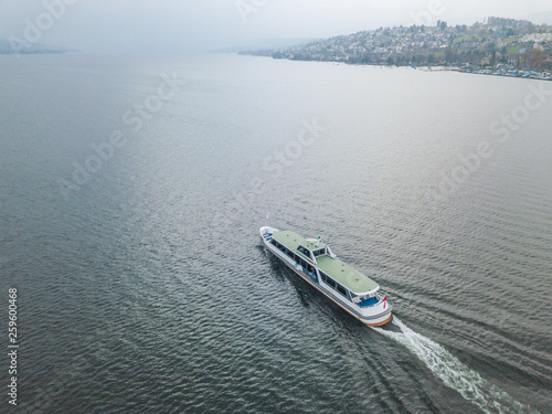 Aerial view of passenger ferry ship cruising on a lake in Switzerland. © Mario