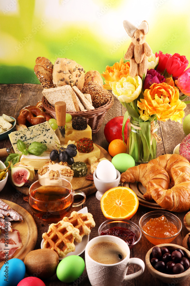 breakfast on table with bread buns, croissants, coffe and eggs breakfast on table with bread buns, croissants, coffe and eggs