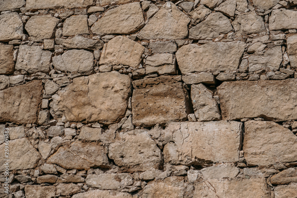 Fototapeta premium Old stone wall texture, blocks of ancient castle surface as background for design