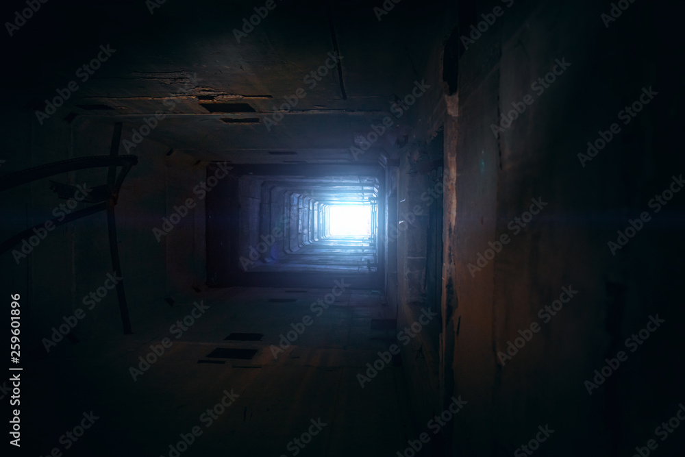 Light in end of old grungy concrete tunnel or tube or corridor, abstract way to hope concept in abandoned scary building Light in end of old grungy concrete tunnel or tube or corridor, abstract way to hope concept in abandoned scary building