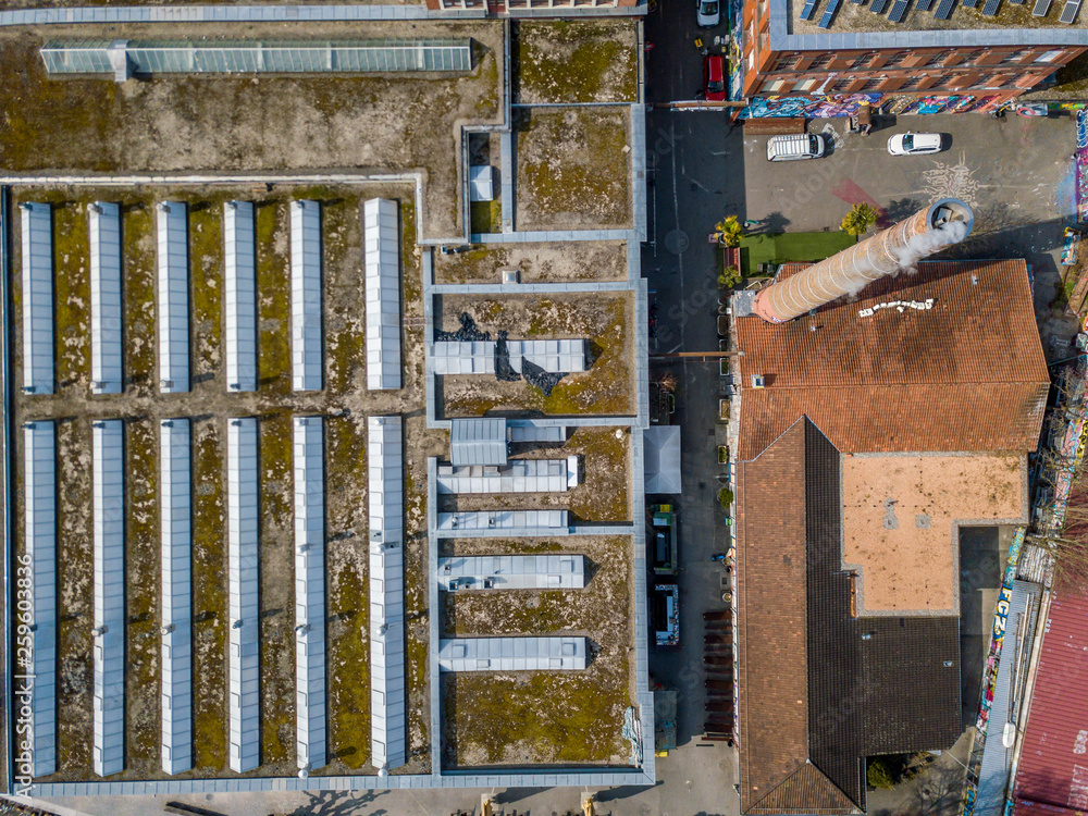Aerial view of roof with windows on roof of industrial building Aerial view of roof with windows on roof of industrial building