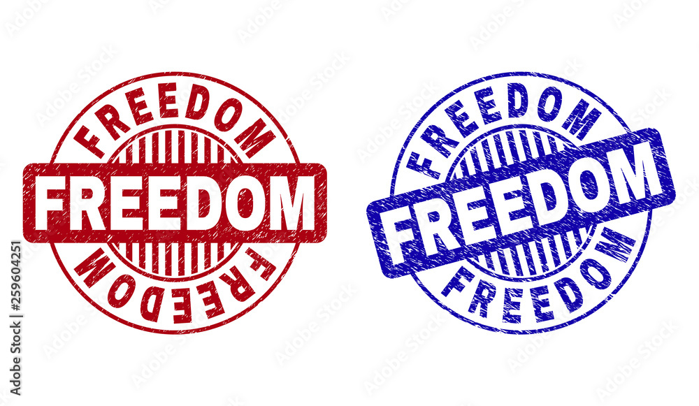 Grunge FREEDOM round stamp seals isolated on a white background. Round seals with grunge texture in red and blue colors. Vector rubber imitation of FREEDOM title inside circle form with stripes. Grunge FREEDOM round stamp seals isolated on a white background. Round seals with grunge texture in red and blue colors. Vector rubber imitation of FREEDOM title inside circle form with stripes.