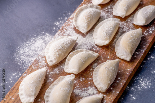 frozen dumplings on a cutting board