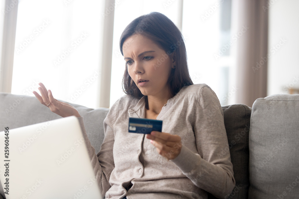 Woman using online banking having problem with blocked credit card Woman using online banking having problem with blocked credit card