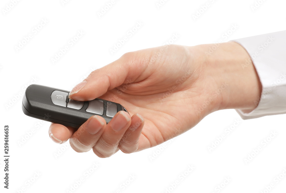 Woman holding car smart key isolated on white Woman holding car smart key isolated on white