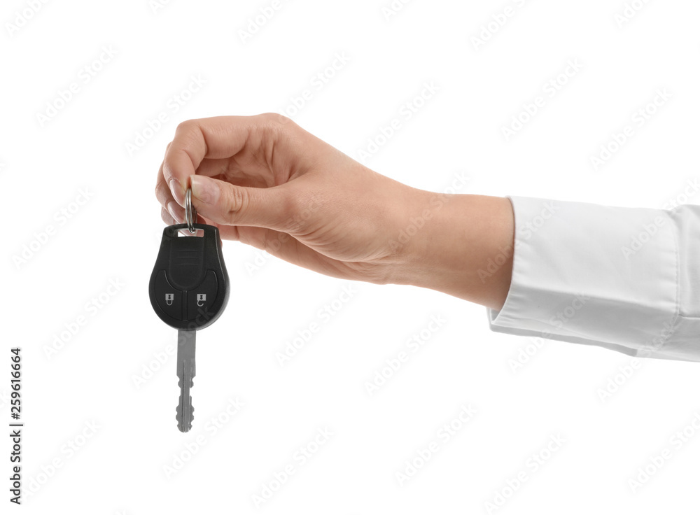 Woman holding car key isolated on white Woman holding car key isolated on white
