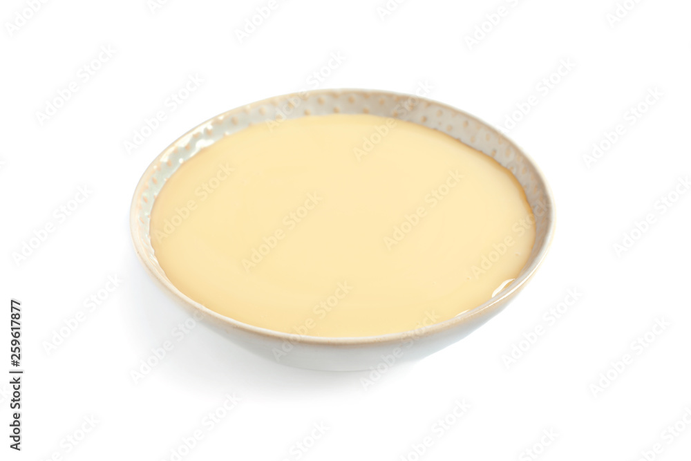 Bowl with condensed milk on white background. Dairy product Bowl with condensed milk on white background. Dairy product