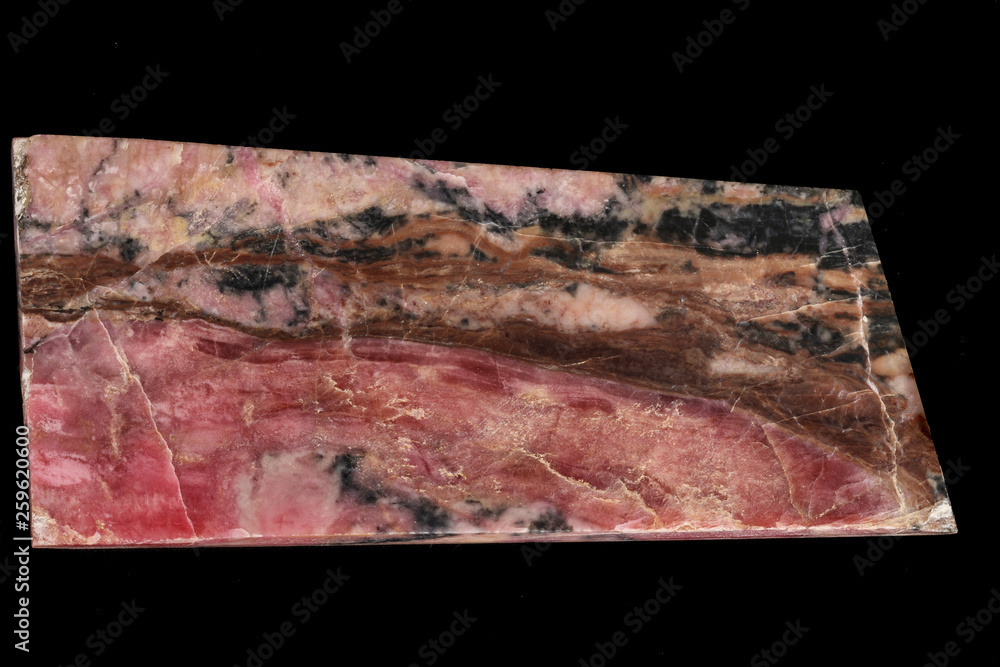 Fototapeta premium Macro stone Rhodonite mineral on a black background