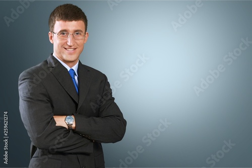 Portrait of happy businessman on background