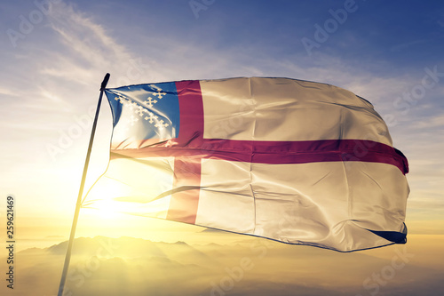US Episcopal Church flag waving on the top sunrise mist fog