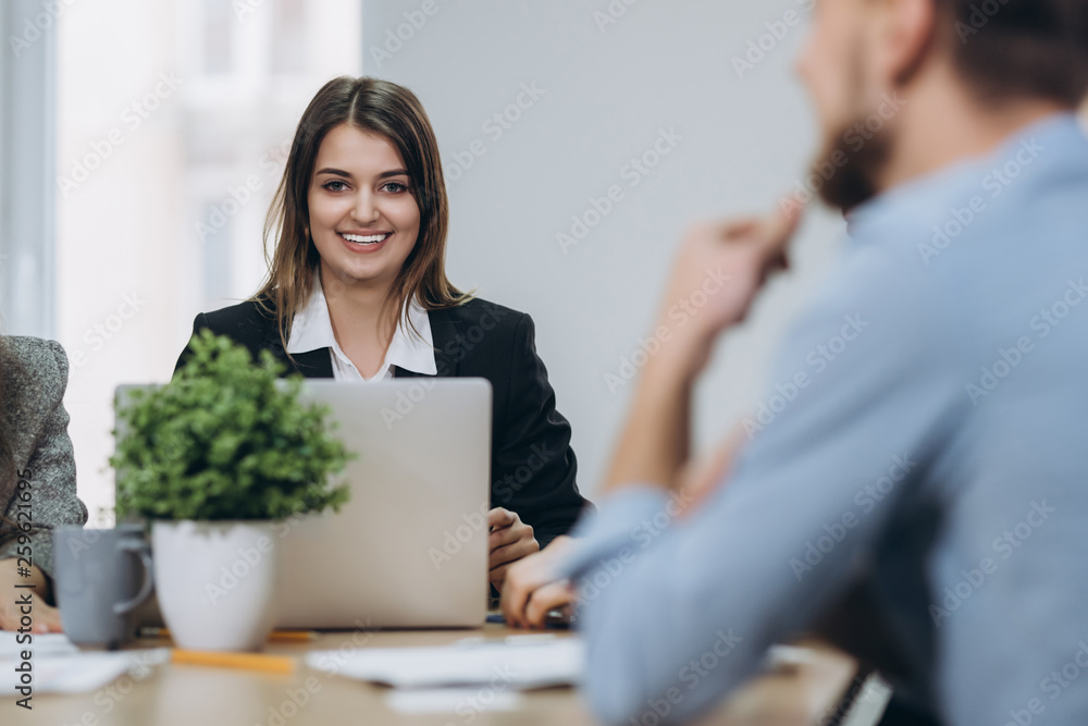 Shot of an attractive mature businesswoman working on laptop in her workstation. Shot of an attractive mature businesswoman working on laptop in her workstation.
