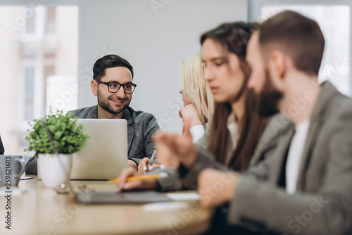 Full concentration at work. Corporate team working colleagues working in modern office