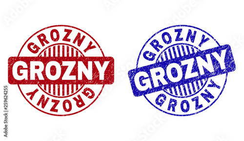 Grunge GROZNY round stamp seals isolated on a white background. Round seals with grunge texture in red and blue colors. Vector rubber imprint of GROZNY title inside circle form with stripes.