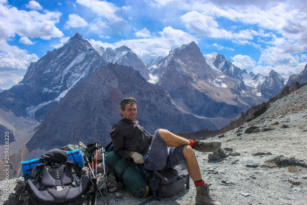 Tourist enjoys the view in the fan mountains Tourist enjoys the view in the fan mountains