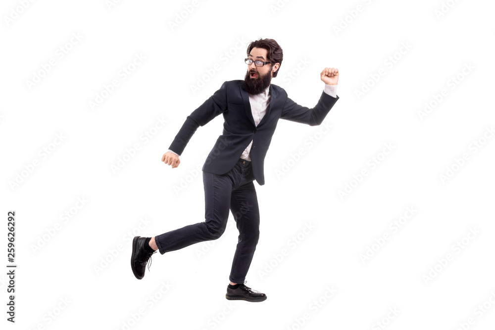 Full length portrait of a run away bearded businessman, isolated on white background Full length portrait of a run away bearded businessman, isolated on white background