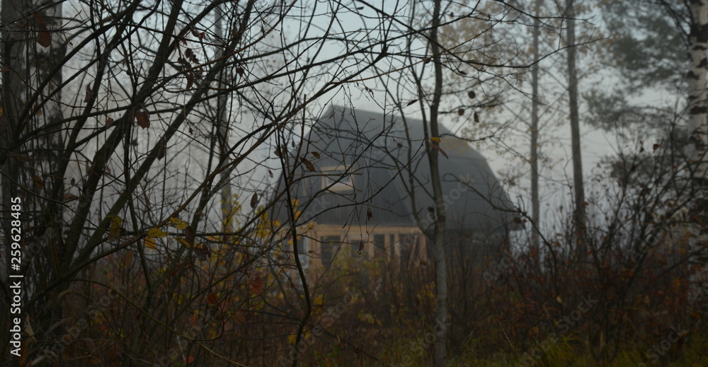Obraz premium village house in a foggy haze