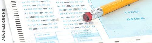 Standardized test form with pencil and eraser with a shallow depth of field and copy space