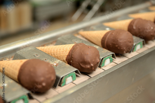 The conveyor automatic lines for the production of ice cream. Production of ice-cream at milk factory