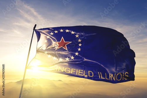 Springfield city capital of Illinois flag waving on the top sunrise mist fog photo