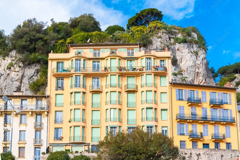 Nice in France, beautiful houses built on hillside, on the marina, with typical windows and shutters 