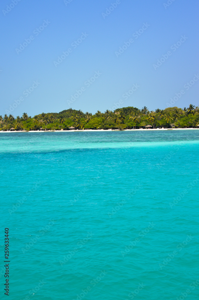 Beautiful tropical Maldives island with beach , sea , and coconut palm tree on blue sky for nature holiday vacation background concept -Boost up color Processing