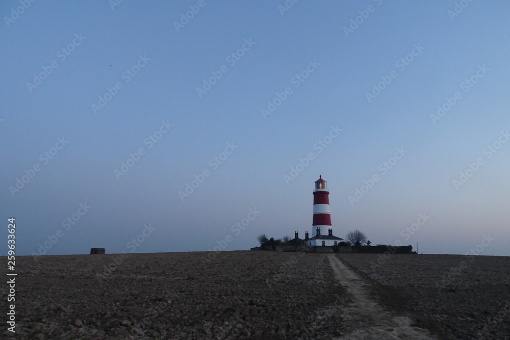 Sunset views of Happisburgh Lighthouse - Norfolk, England, UK Sunset views of Happisburgh Lighthouse - Norfolk, England, UK
