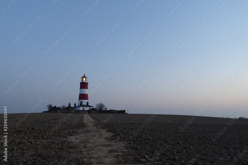 Sunset views of Happisburgh Lighthouse - Norfolk, England, UK Sunset views of Happisburgh Lighthouse - Norfolk, England, UK