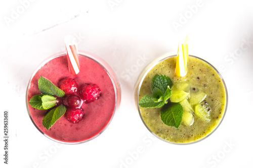 Fruit and berry smoothie blend at home on a light background top view copy space.