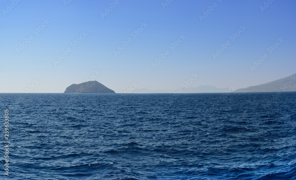 Panorama of the Aegean Sea overlooking the next islands and mountains in the summer evening after a decline. it is sewed from four vertical pictures Panorama of the Aegean Sea overlooking the next islands and mountains in the summer evening after a decline. it is sewed from four vertical pictures