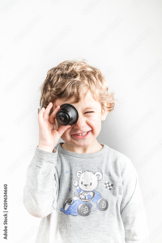 Fototapeta premium Child playing with coffee capsules